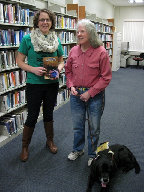 Donna donates The Heart of Applebutter Hill to Abington Community Library Dir. of Youth Services Laura Garloski: photo by Rich Hill.