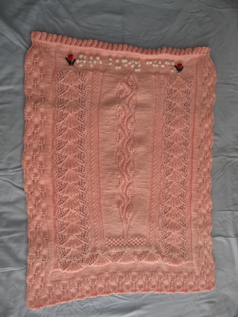 Pink breast-cancer-awareness afghan for WYOU anchor Lyndall Stout's Buddy Check segment; designed and knit by The Heart of Applebutter Hill author Donna W. Hill, features twining vine surrounded by butterflies and candle flames: photo by Rich Hill