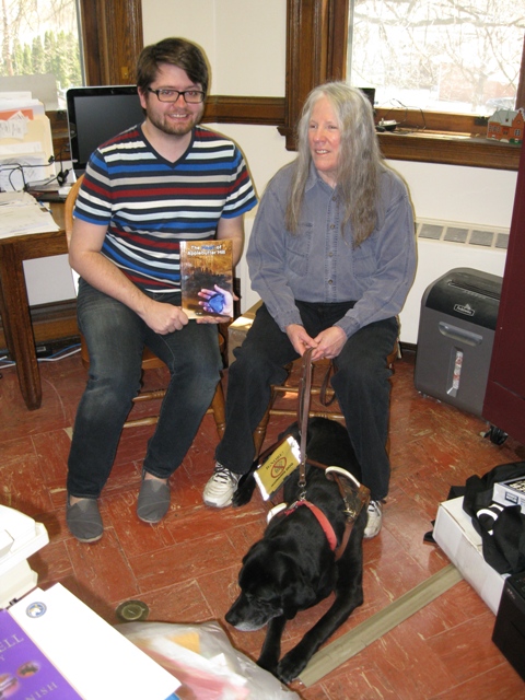 Donnna W. Hill  - with Hunter, a black Lab & her 4th guide dog - donates The Heart of Applebutter Hill to Dir. Jesse Johnson of the Towanda Public Library: photo by Rich Hill.