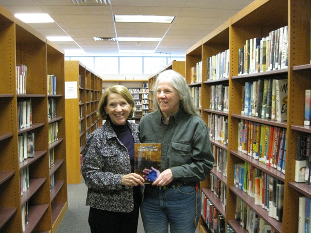 Donna presents a copy of The Heart of Applebutter Hill to Dir. Kristin Smith Gary at the Wyoming County Public Library in tunkhannock, Pa: photo by Rich Hill