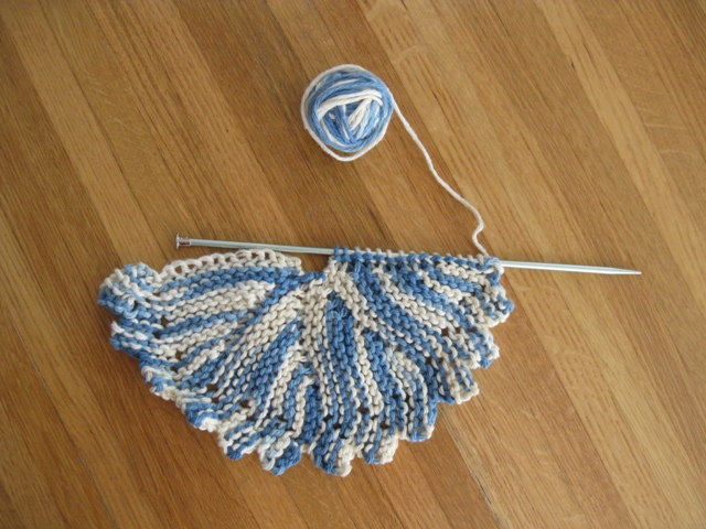 Round Dishcloth on Needles Shows Curve of Short-row Knitting: photo by Rich Hill.